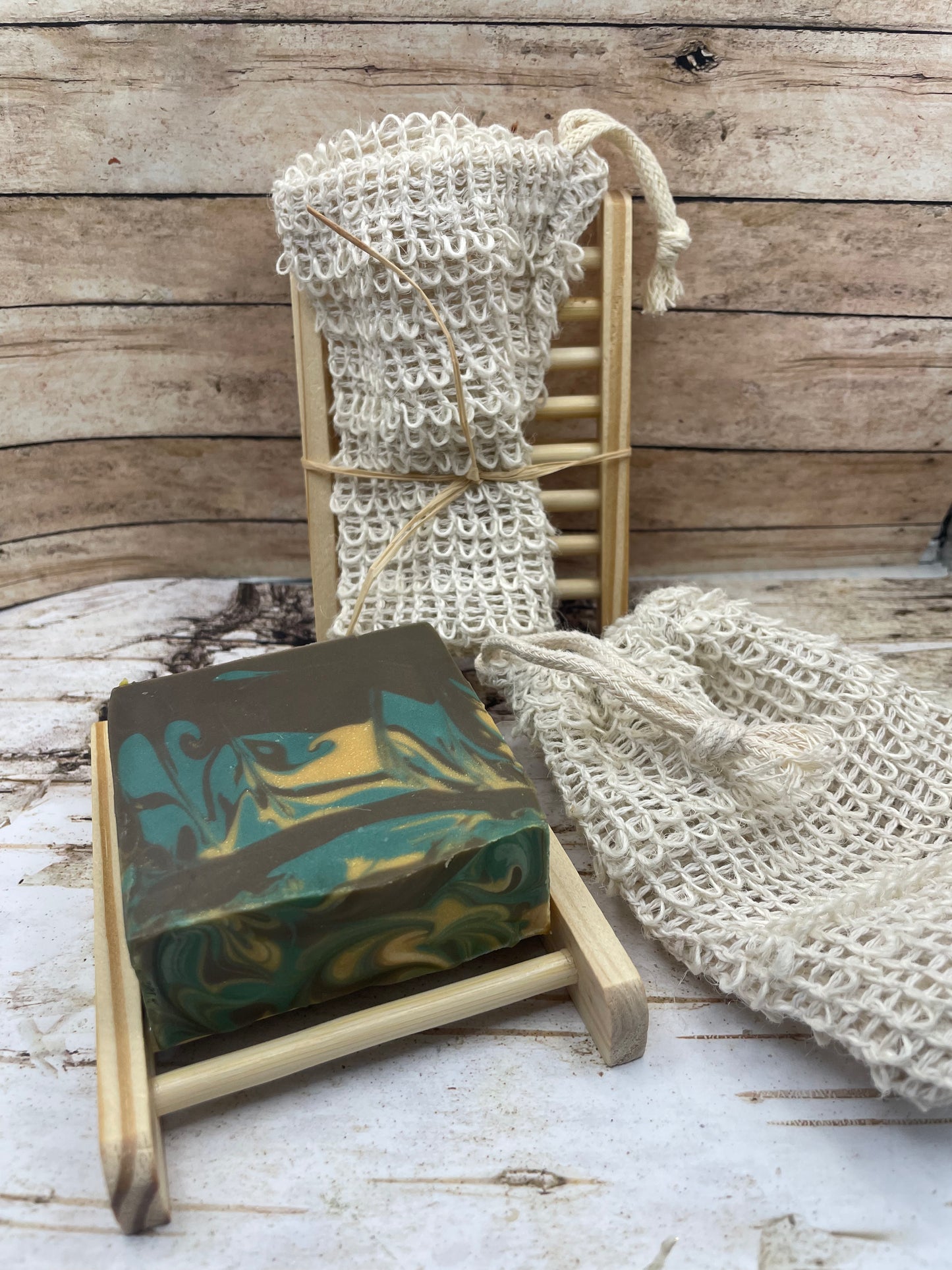 Soap saver bag and natural colored wooden soap dish
